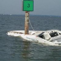 look at the boats name