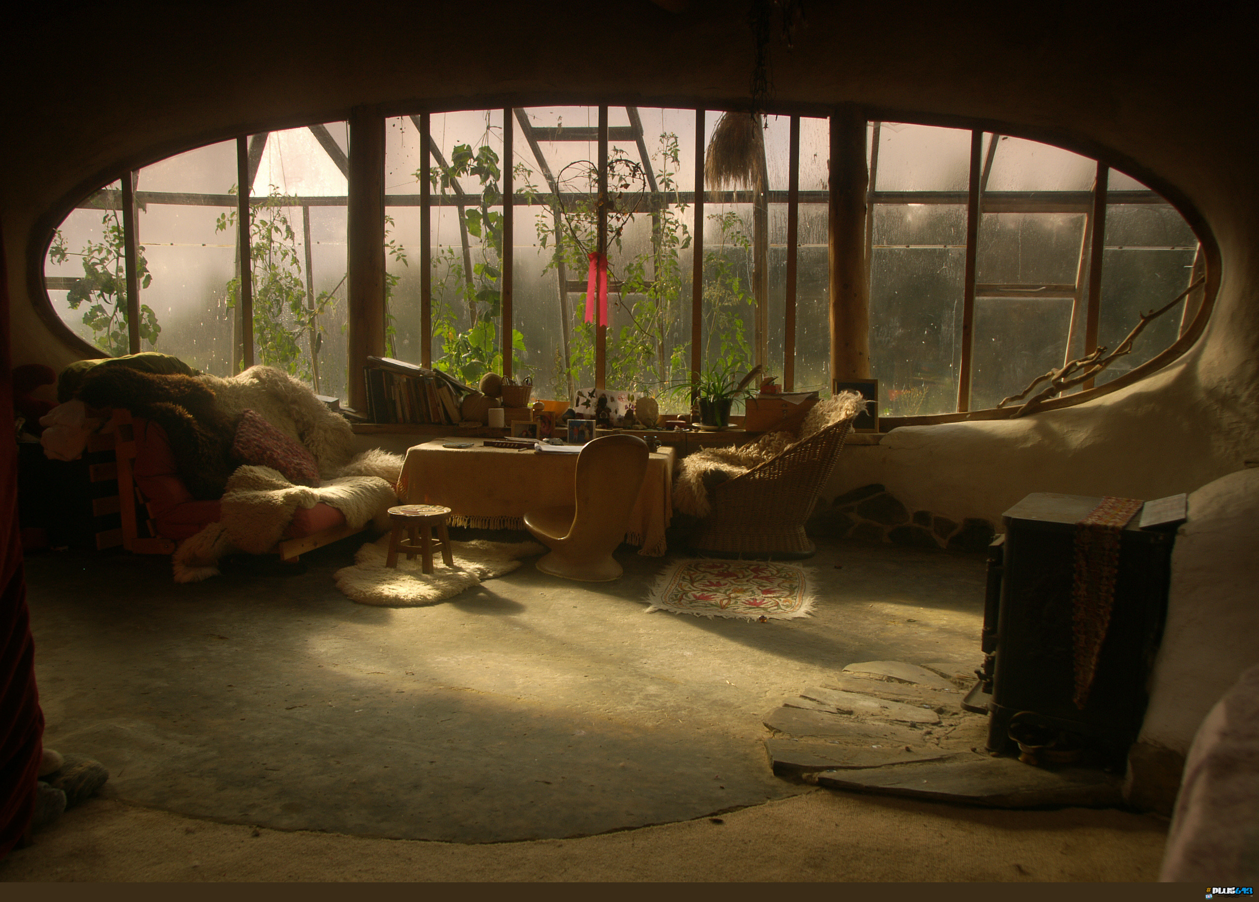 Lounge room looking into a green house