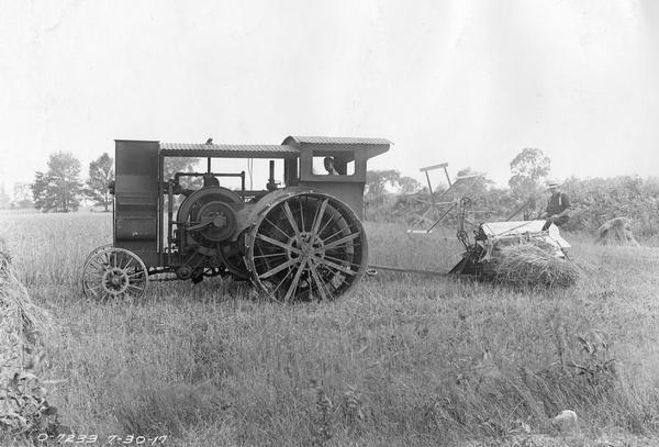 early gasoline tractor at work