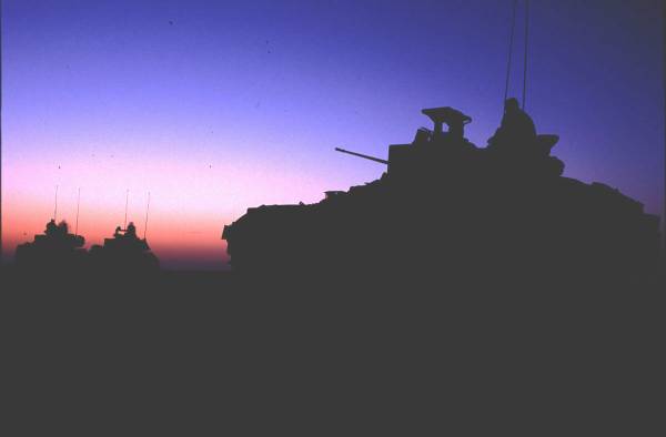 Bradley fighting vehicles at dawn. Kuwait border 1991
