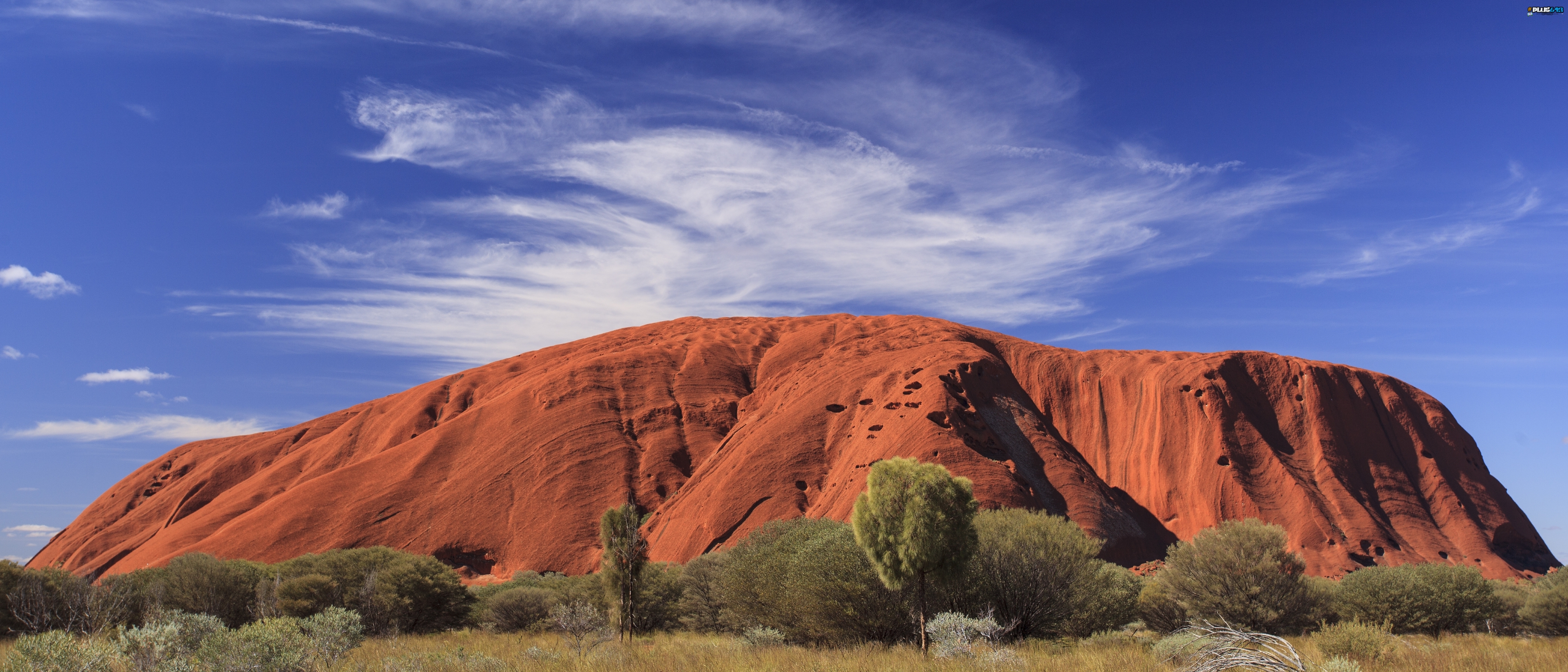 Largest exposed monolith, nation's centre, politics changed the name to Uluru.