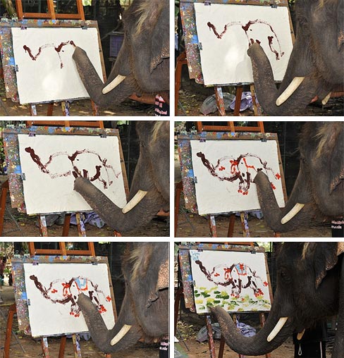 An elephant paints a picture of another elephant