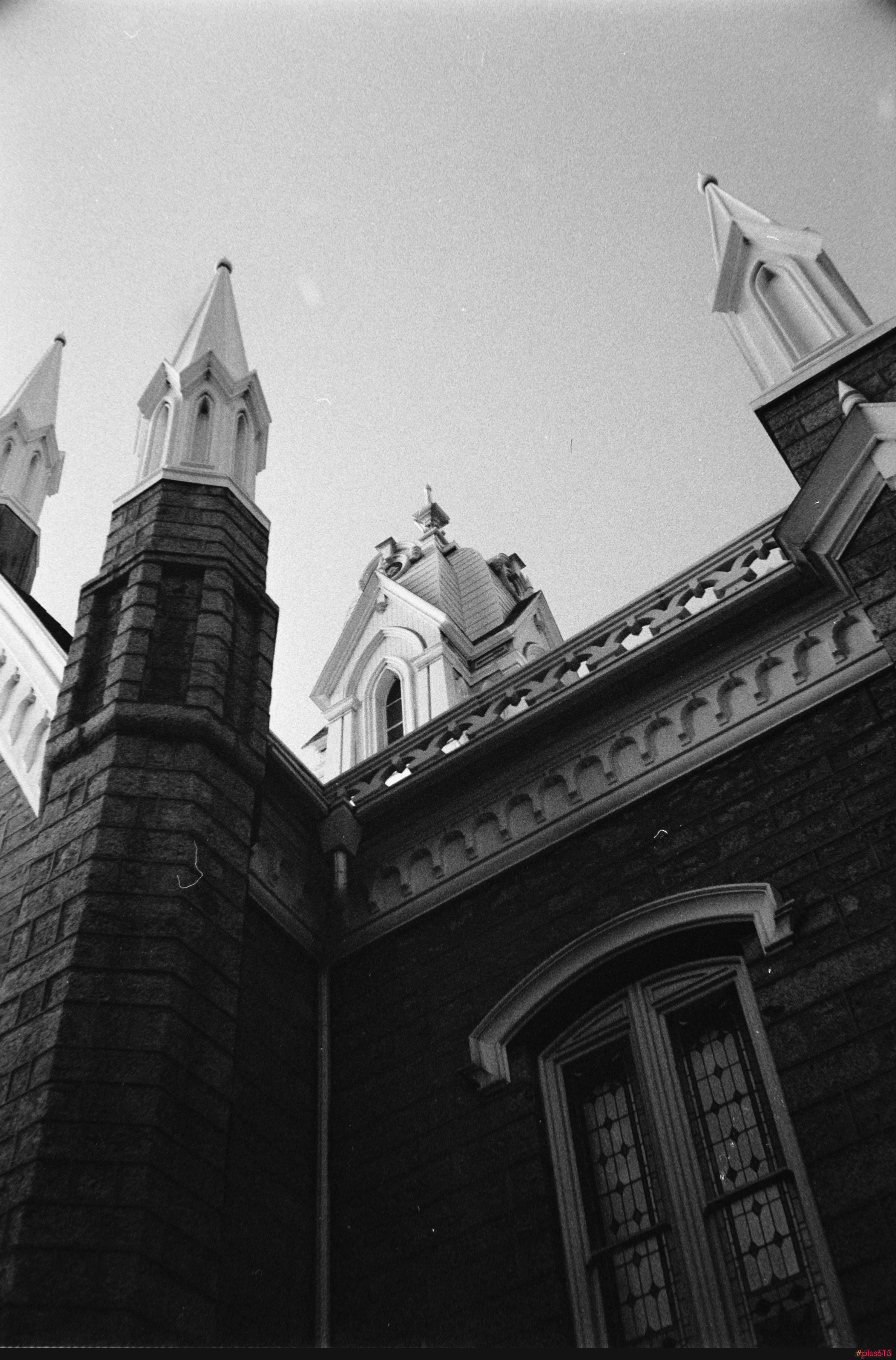 Close-up of a historic building with spires and dome by Spencer Plouzek