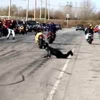 man not standing on his bike