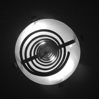 a lamp and an oranment dangling from it. is it art?