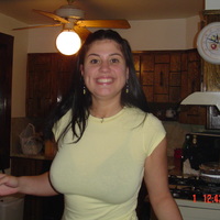 i like the way her shirt matches her teeth...really nice tits though...