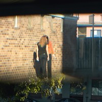 two lesbians kissing while on their smoke break