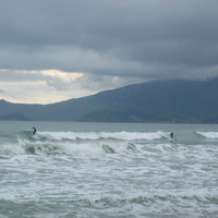 surfing on the Feniglia beach (Monte Argentario, Touscany, Italy)