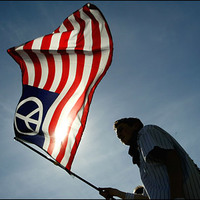 Flag Boy at a march  for national unity, liberal or conservative.